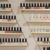 white and black bottles on brown wooden shelf