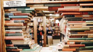 books on brown wooden shelf