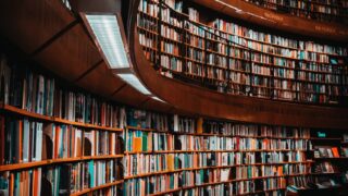 photo of brown wooden bookshelf