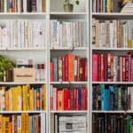 books on white wooden shelf