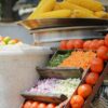 a group of vegetables in baskets